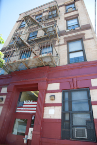 On Washington Ave., around the corner from Irv’s old address is a four-story tenement that Irv says is like the one he grew up in. He shows us this because his building was torn down.  Photo by Pat Arnow