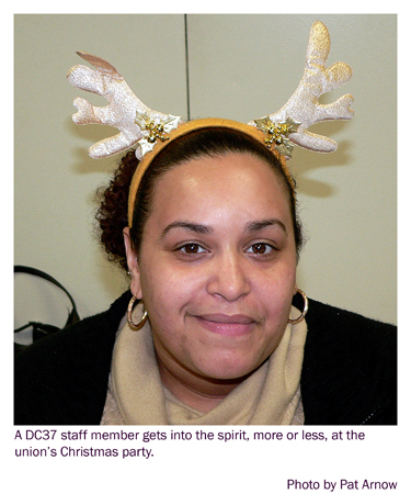 DC37 member wears reindeer horns at the city workers' union Christmas party. Photo by Pat Arnow