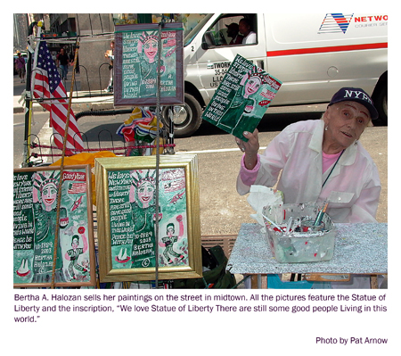 Bertha Halozan paints the Statue of Liberty over and over. She sells her childlike renditionso f the statue on the streets of New York City. Photo by Pat Arnow