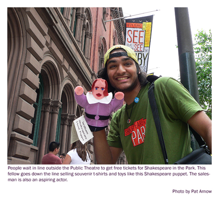 Souvenir seller at the line for tickets for Shakespeare in the Park. Photo by Pat Arnow
